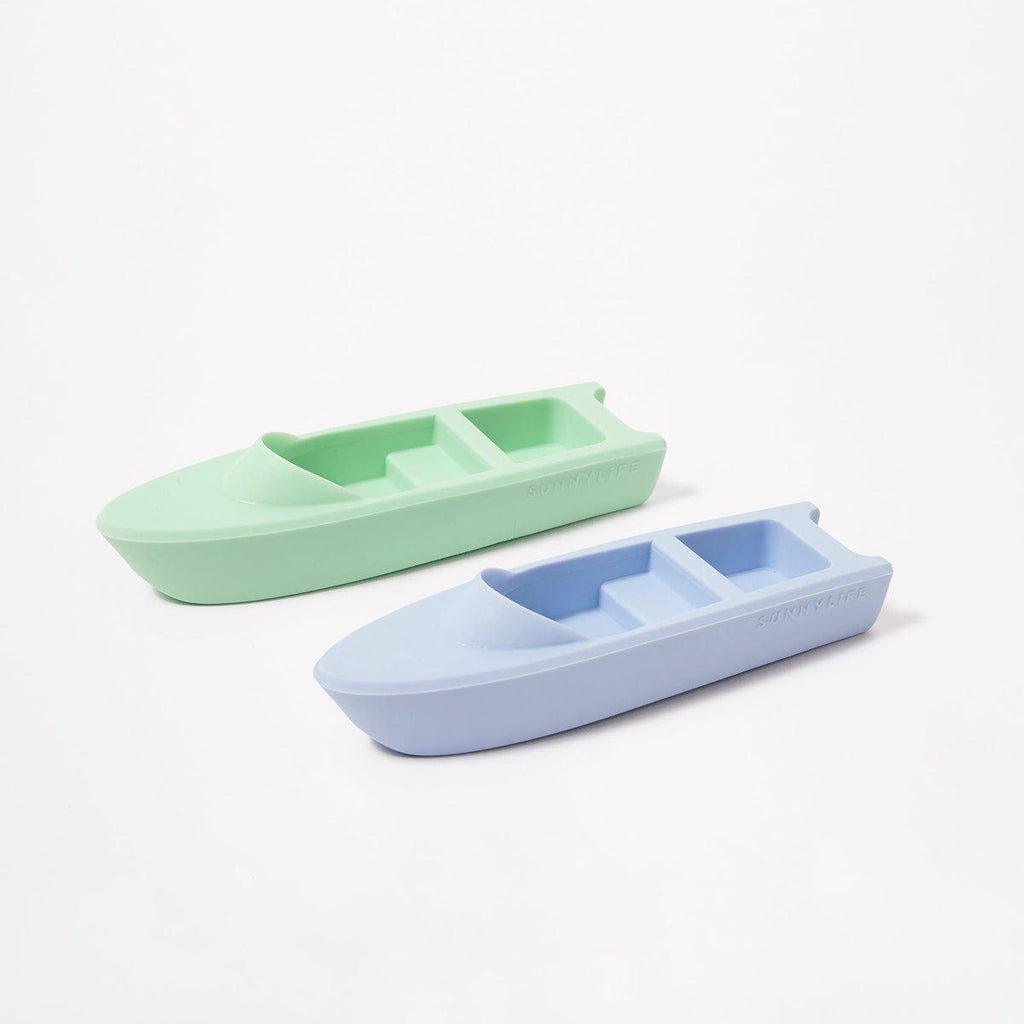 small plastic toy boats